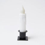 Short white taper candle