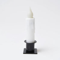 Short white taper candle