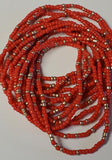 Red beaded bracelets on a light gray background